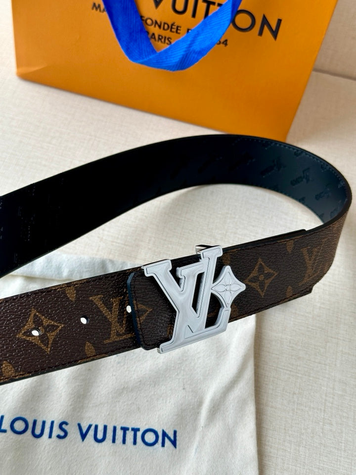 Louis Vuitton monogram belt close-up with dark strap and silver-tone LV buckle
