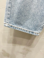Maison Margiela denim jeans cuff hem in light wash denim with stitched edge