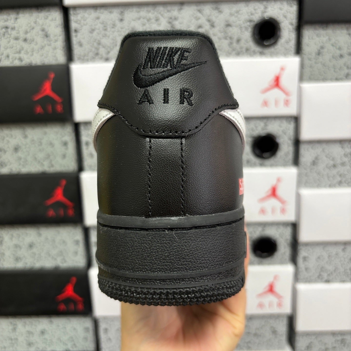 Black low-top sneaker heel with Nike Air logo on back