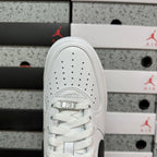 White low-top sneaker with lace-up vamp and perforated toe, top view
