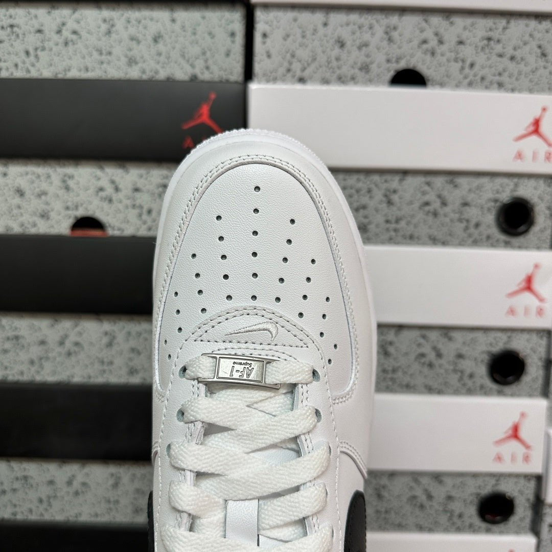 White low-top sneaker with lace-up vamp and perforated toe, top view