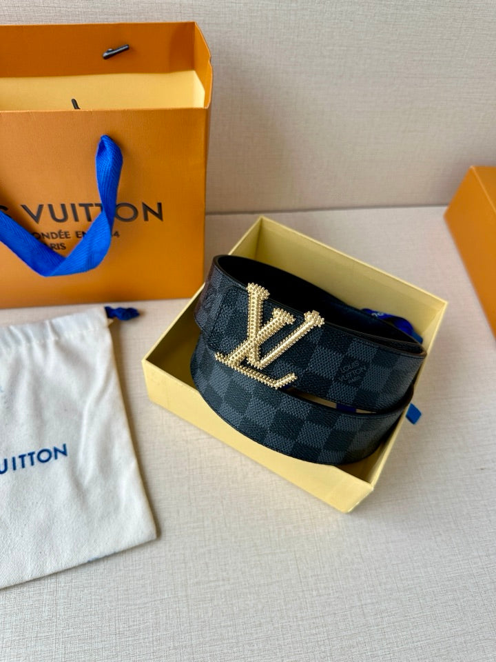 Belt on display with dark checkered strap and gold-tone LV buckle, adjustable punched holes