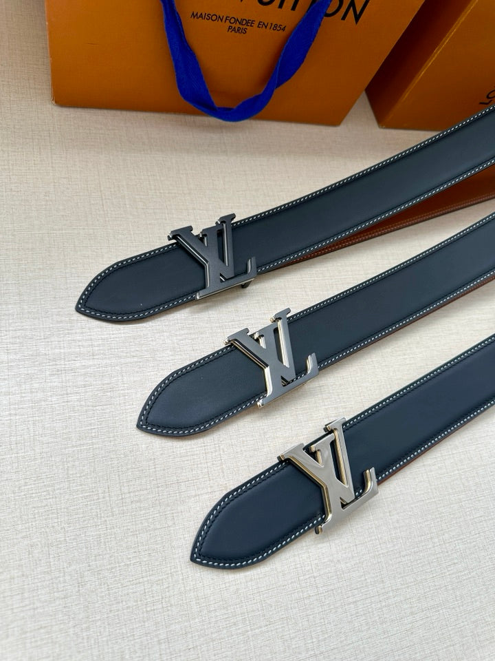 Louis Vuitton belt close-up, dark blue leather straps with silver LV buckle details