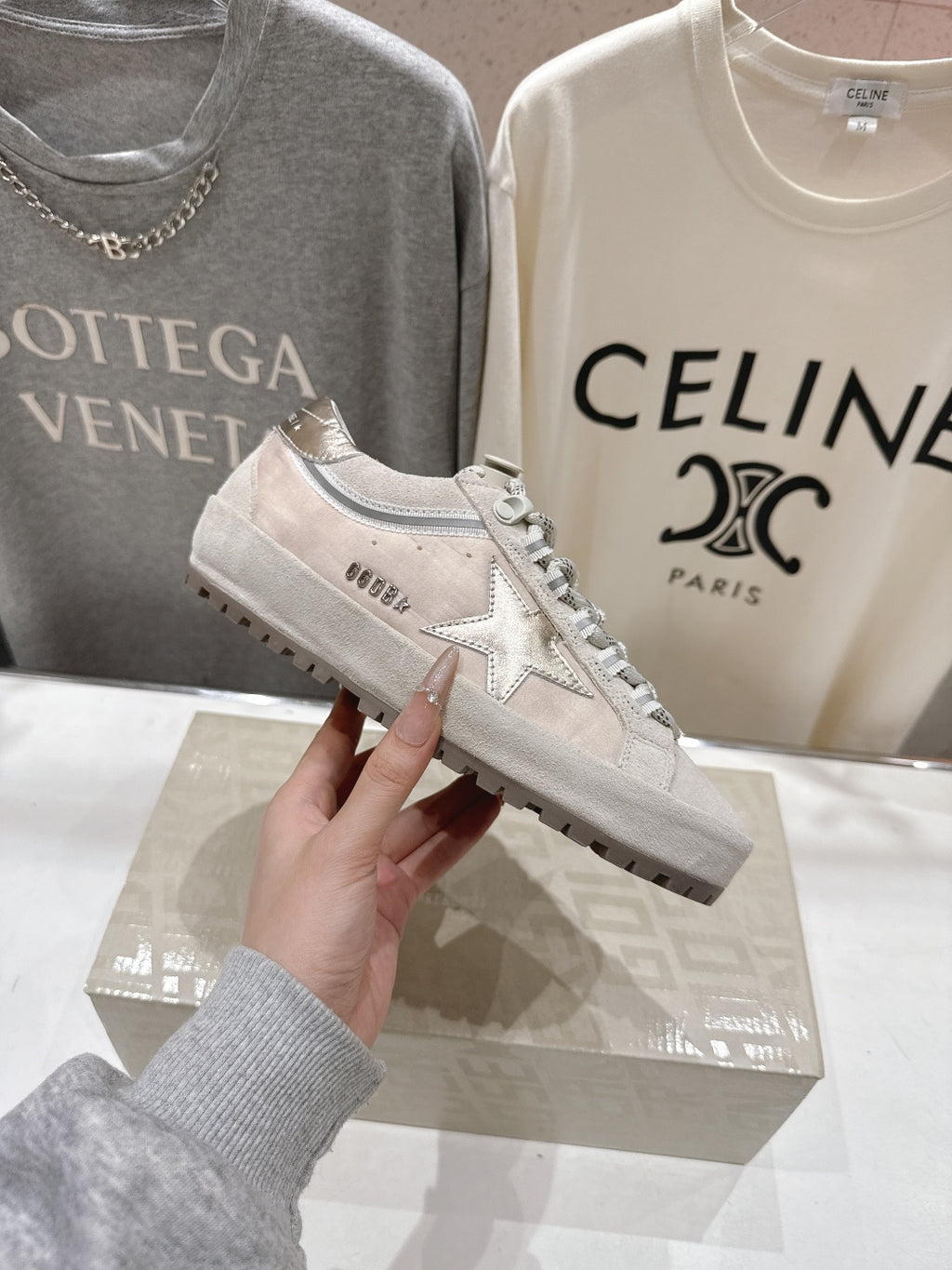 Golden Goose light gray lace-up sneaker with metallic star side and patterned laces