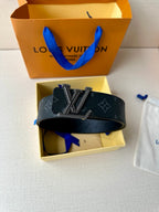 Louis Vuitton belt on box with dark blue monogram strap and LV rhinestone buckle