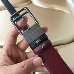 Prada belt with dark blue webbing, burgundy leather, and large silver-tone buckle