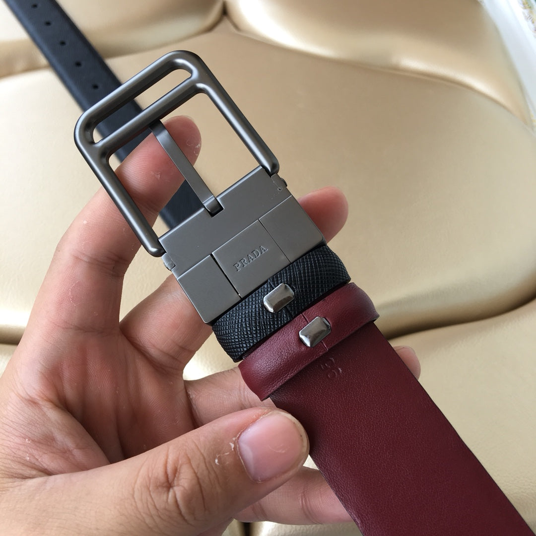 Prada belt with dark blue webbing, burgundy leather, and large silver-tone buckle