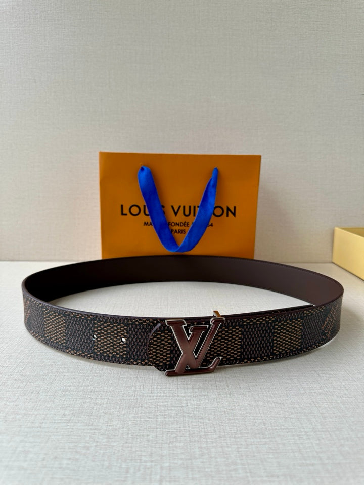 Louis Vuitton belt with dark patterned strap and silver-toned V buckle