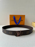 Louis Vuitton belt with dark patterned strap and silver-toned V buckle