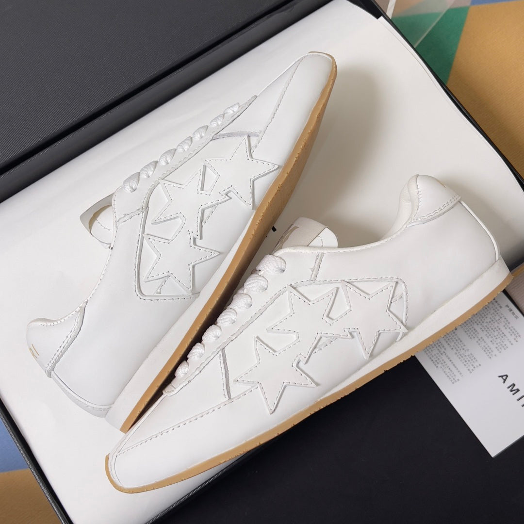 Amiri white sneakers with embossed star detailing and perforated lace overlay