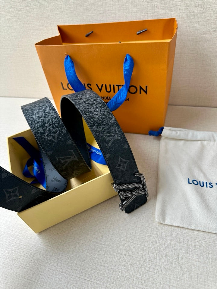 Louis Vuitton belt with dark blue monogram strap and LV rhinestone buckle