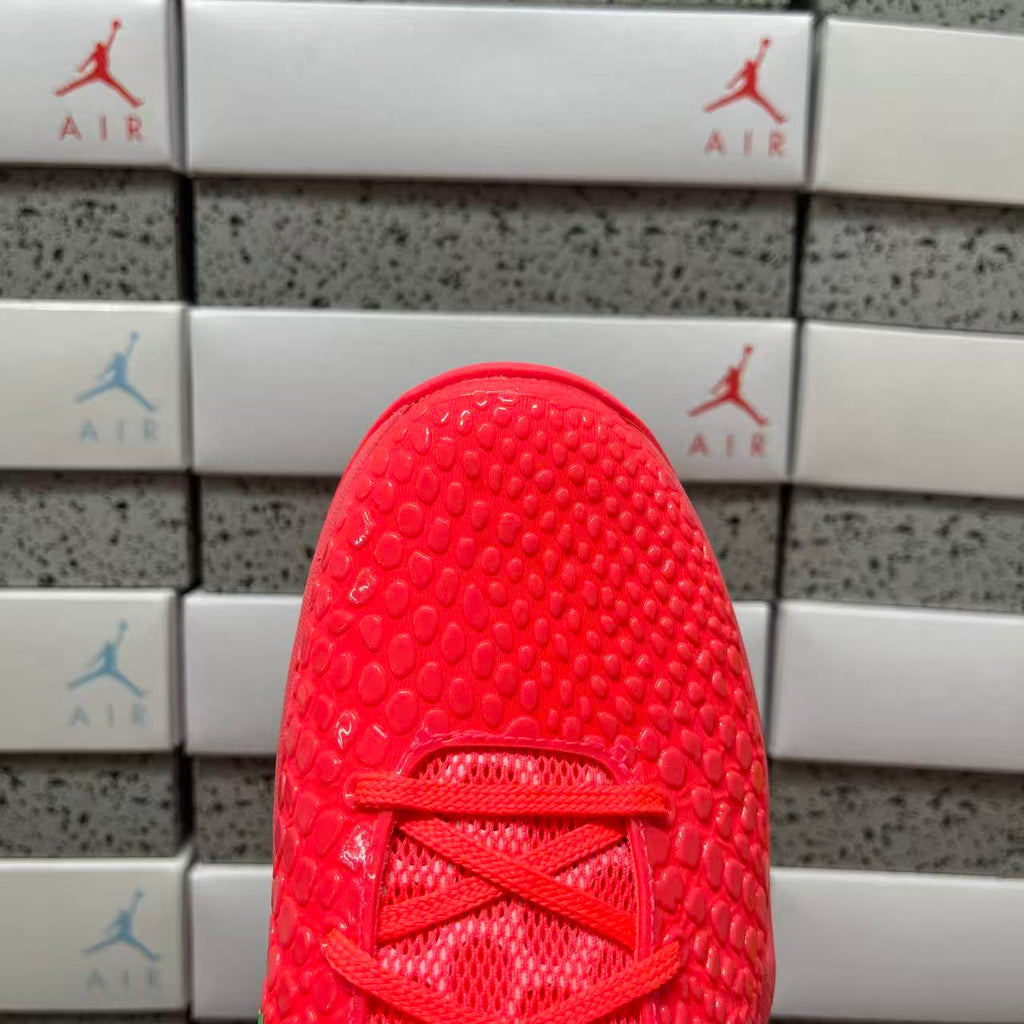 Red sneaker tongue and laces close-up with textured upper