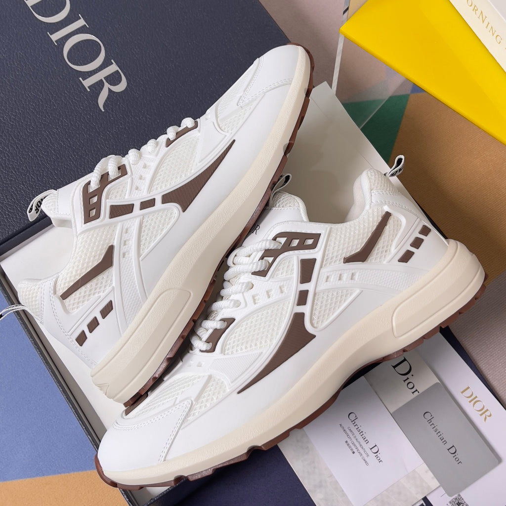 Dior unisex sneakers on box, white with brown logo stripe and lace-up upper detail