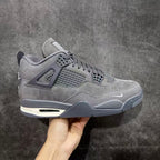 Gray suede Air Jordan 4-style sneaker with mesh panel and lace-up closure