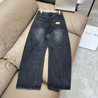 Maison Margiela dark wash denim jeans with straight-wide fit and distressed finish