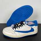 White and blue low-top sneakers showing outsole and lace decoration