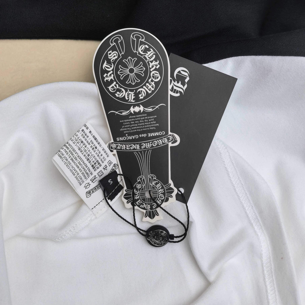 Garment tag and neck label on white raglan shirt