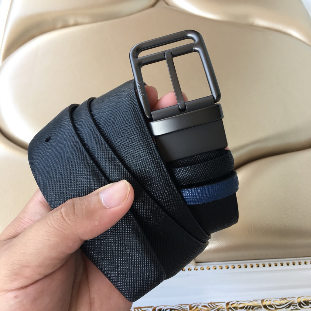 Navy Prada belt with dark buckle and two-layer webbing strap, showing keeper band