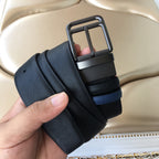 Navy Prada belt with dark buckle and two-layer webbing strap, showing keeper band