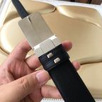 Black leather belt with silver-tone buckle and square keeper tabs