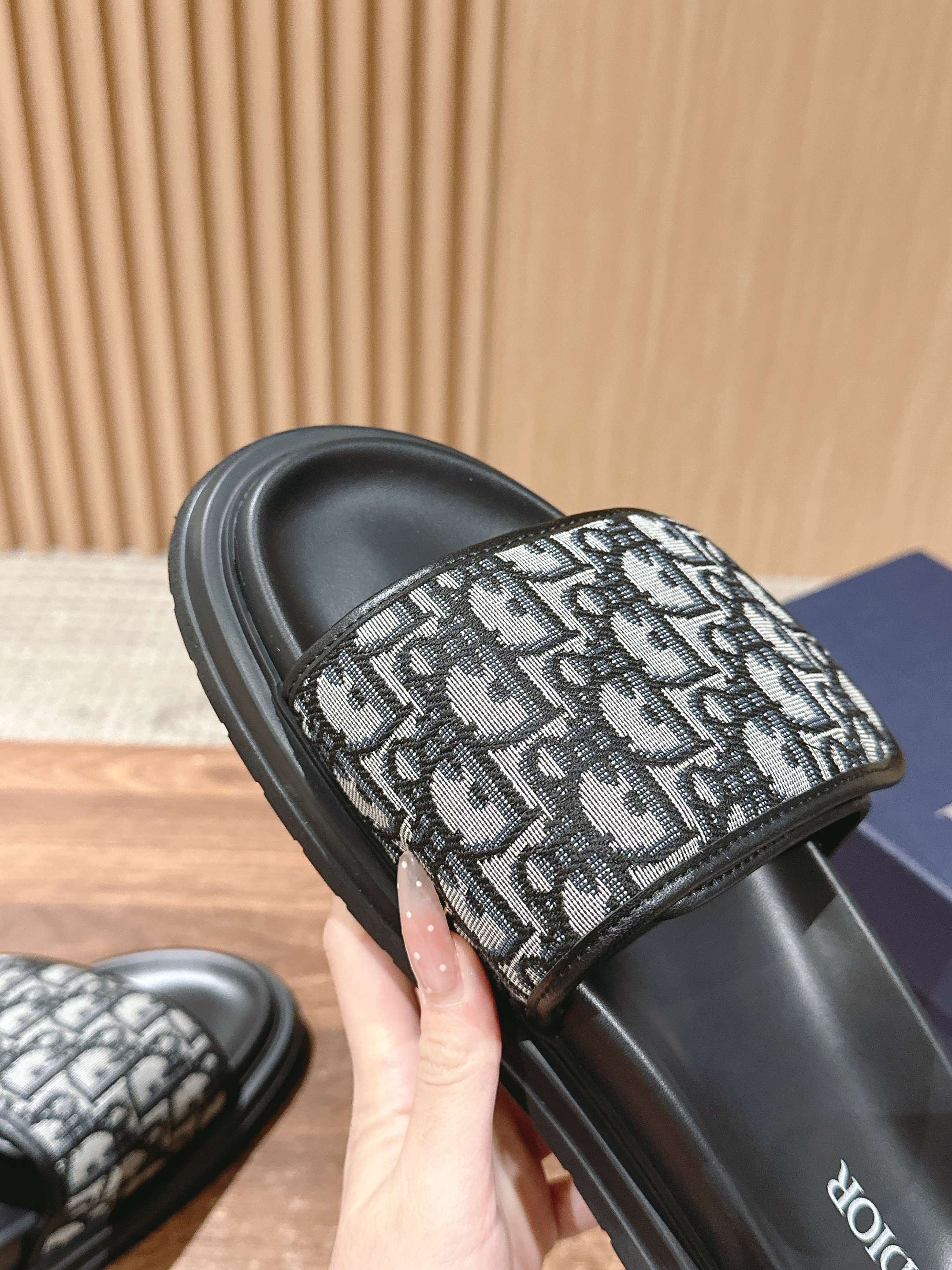 Dior slide sandals with close-up Dior monogram strap over black slide sole