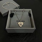 Heart pendant necklace with silver chain and heart charm in gray gift box