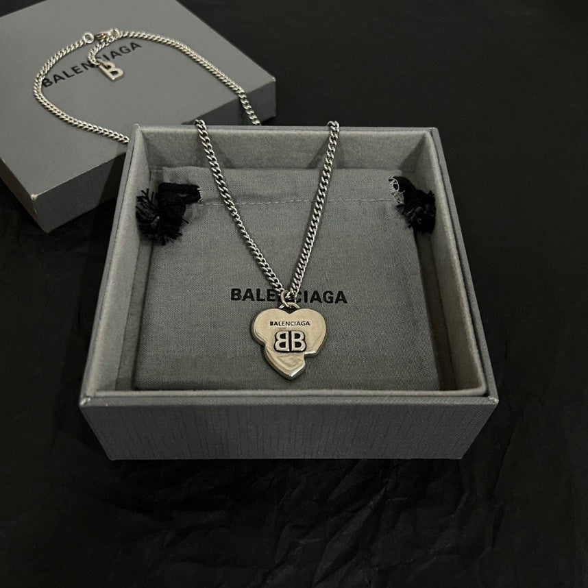Heart pendant necklace with silver chain and heart charm in gray gift box