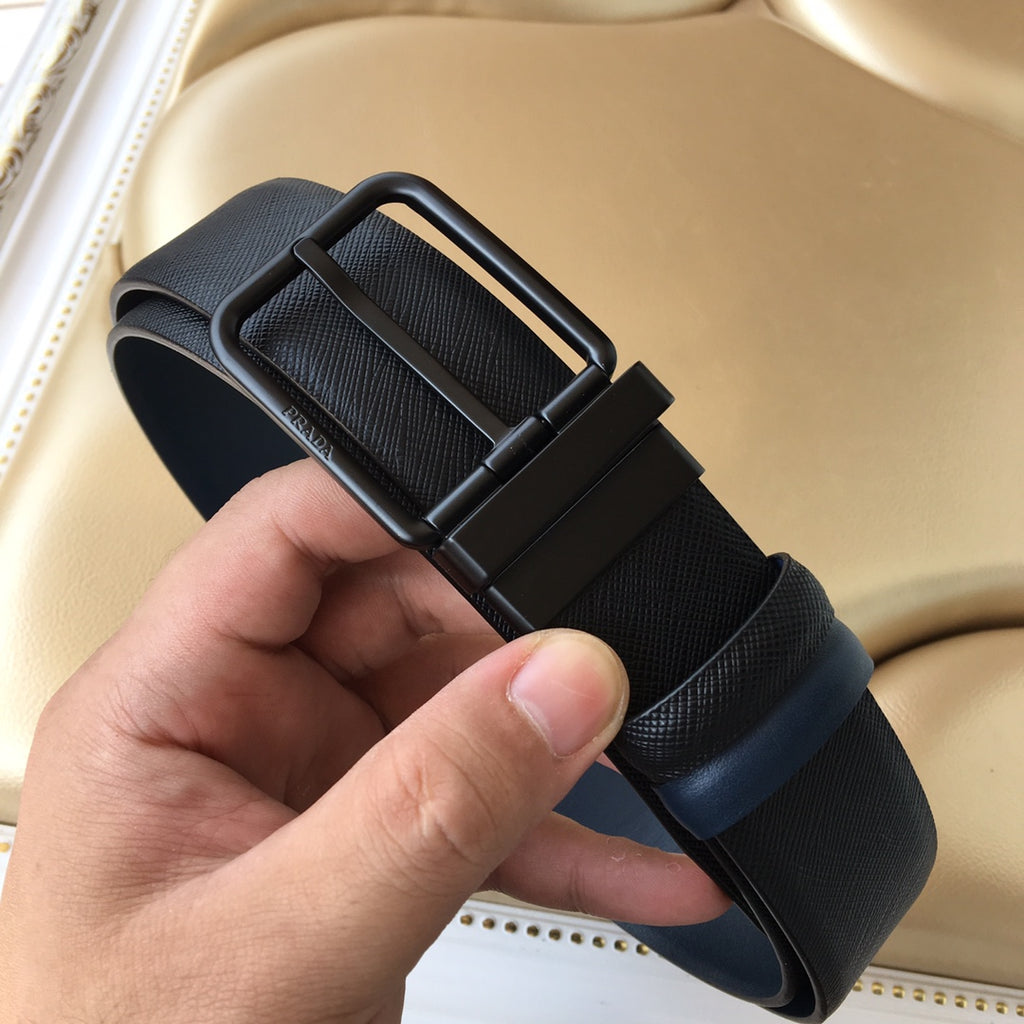 Navy belt with arched buckle and textured strap, shown end view.