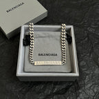 Balenciaga small chain-trim pouch bag with silver links and BALENCIAGA logo panel
