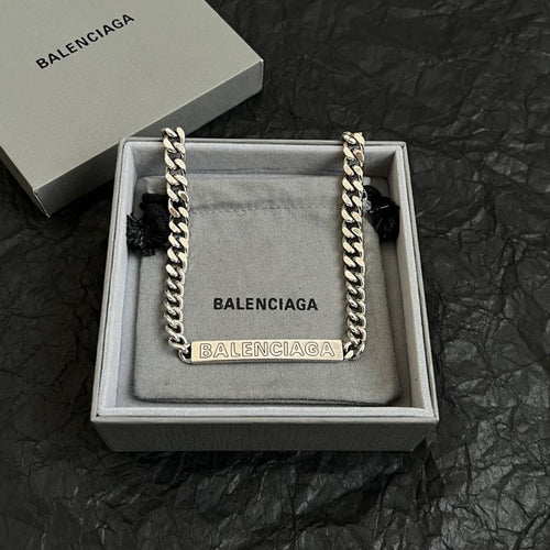 Balenciaga small chain-trim pouch bag with silver links and BALENCIAGA logo panel
