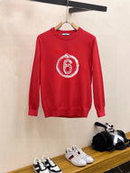 Red crewneck sweatshirt with long sleeves and “6” graphic print on chest