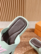 Louis Vuitton slide sandal sole view with mint edges and dark brown interior