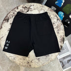 Black drawstring shorts with side pocket and small left number print