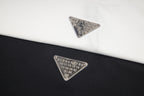 Maison Margiela embroidered triangular logo on T-shirt fabric