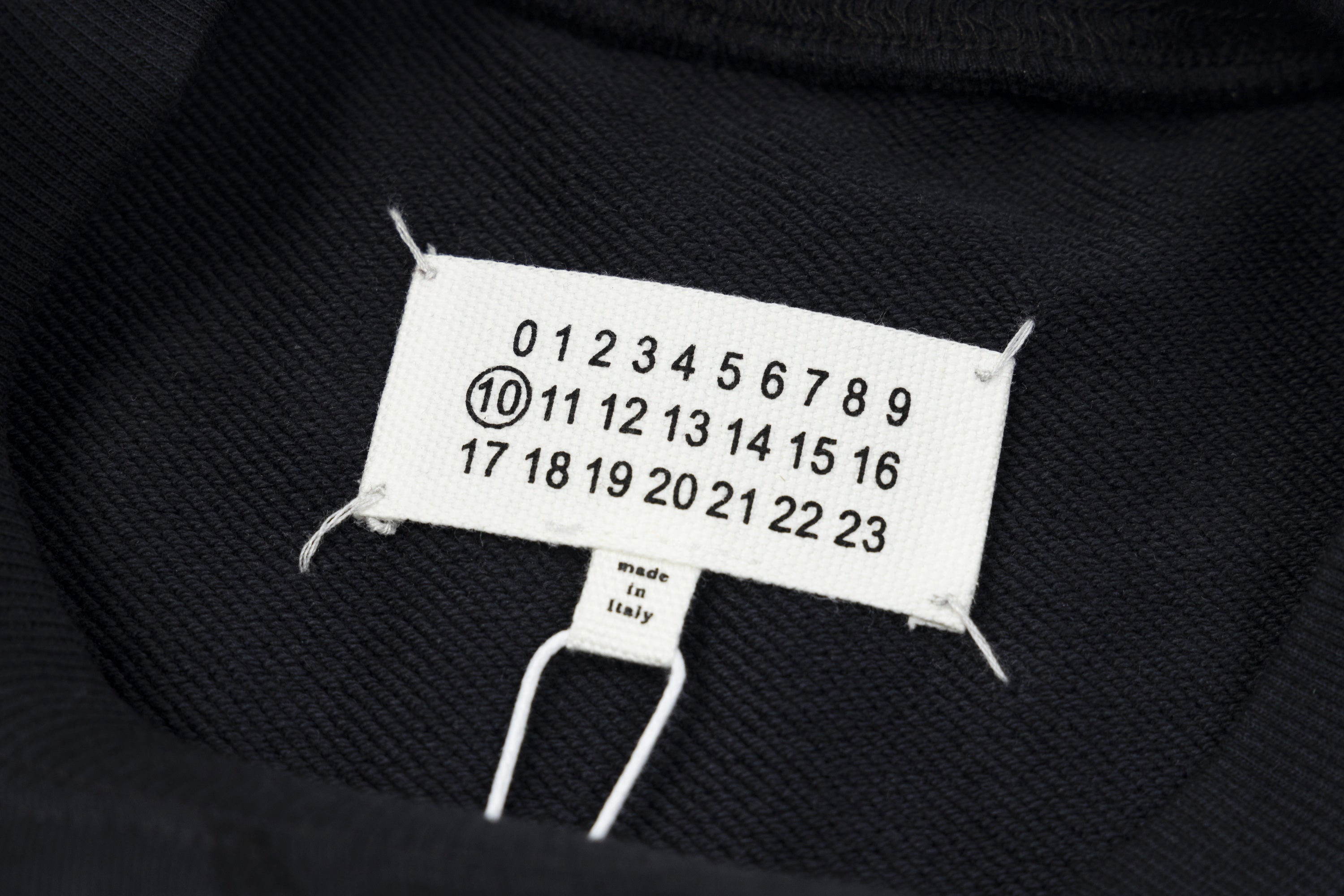 Navy crewneck sweatshirt neck tag with size numbers and Made in Italy