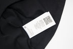 Black Maison Margiela T-shirt with white fabric label and QR code