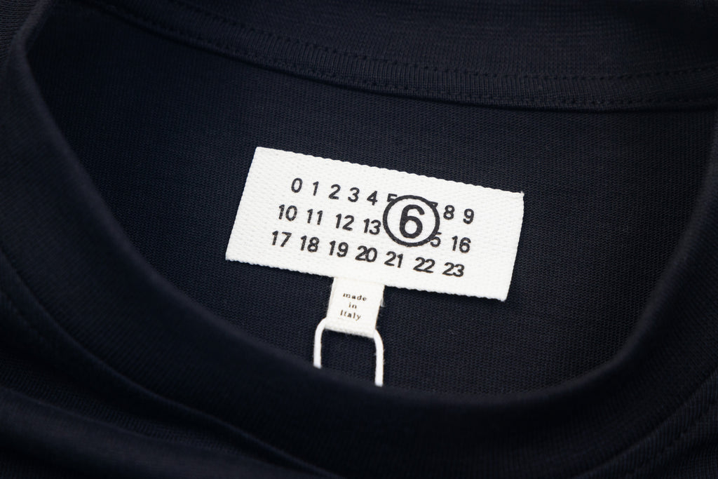 Navy crewneck T-shirt neckline with size label and numeric chart