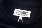 Navy crewneck T-shirt neckline with size label and numeric chart