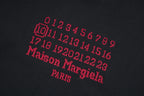 Black T-shirt with red and gray graphic numbers and text