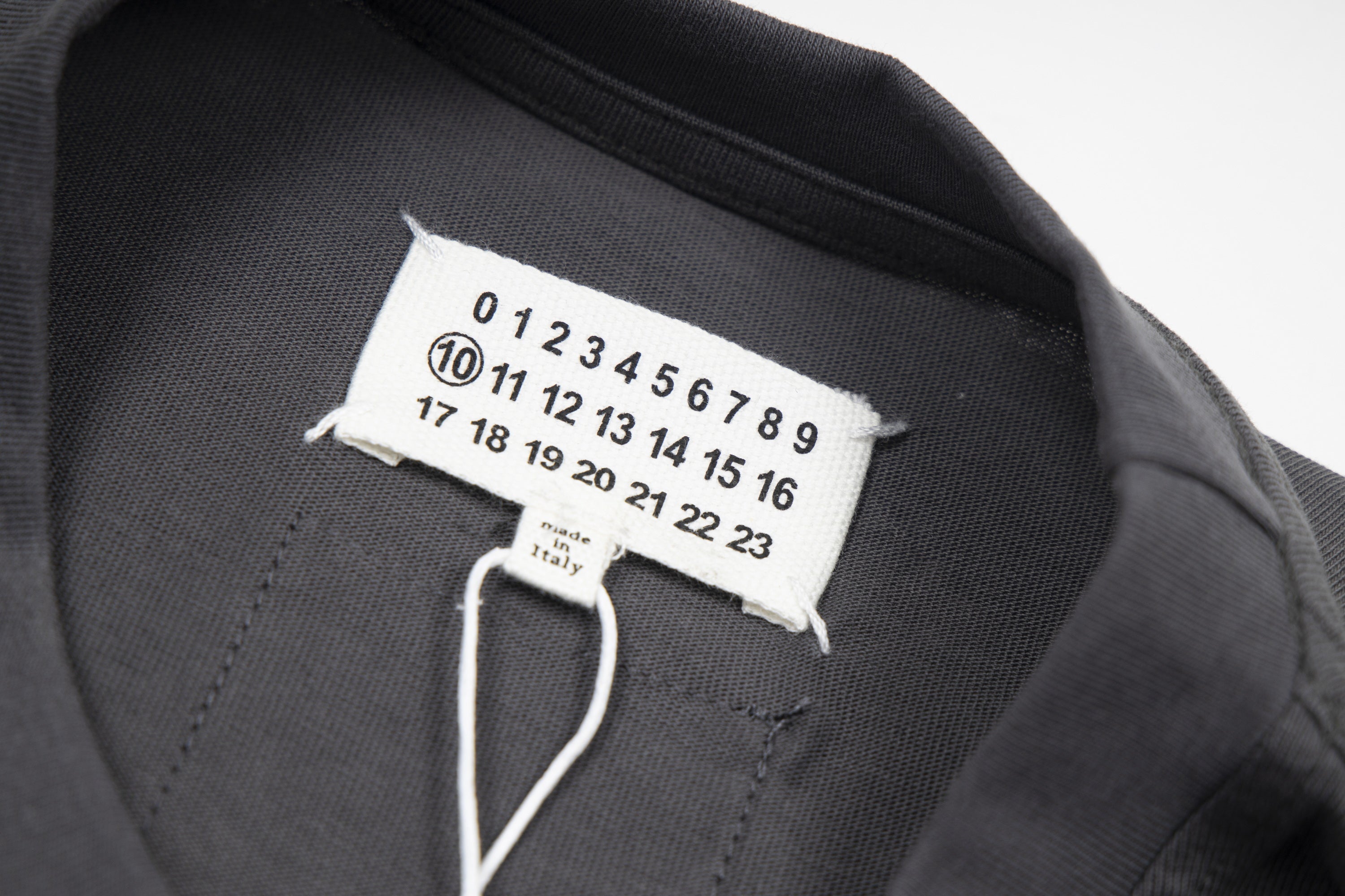 T-shirt interior size label close-up with numbered print