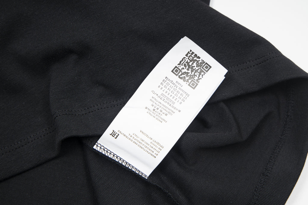 Black T-shirt care label inside collar