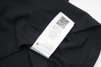 Black T-shirt care label inside collar