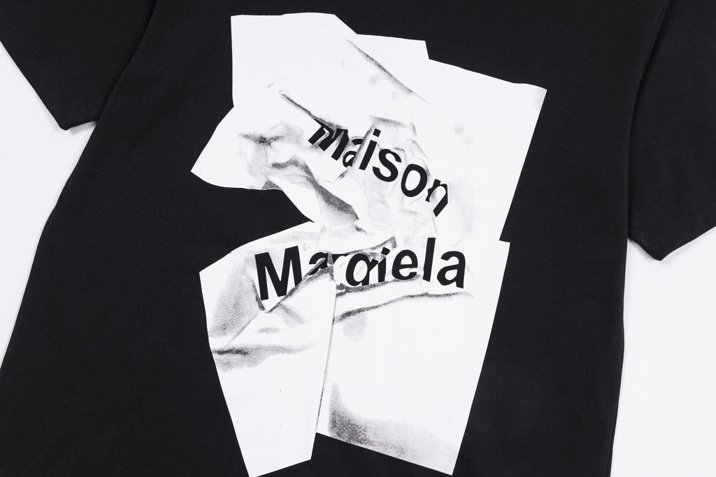 Maison Margiela black T-shirt close-up with white layered logo print