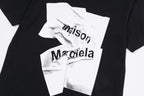 Maison Margiela black T-shirt close-up with white layered logo print