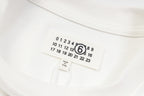 White long-sleeve T-shirt neckline label with size numbers and brand mark