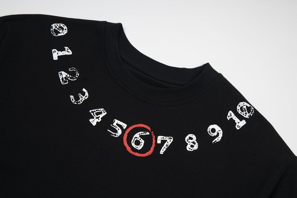Black T-shirt with illustrated number graphic and red 6
