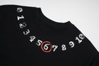 Black T-shirt with illustrated number graphic and red 6