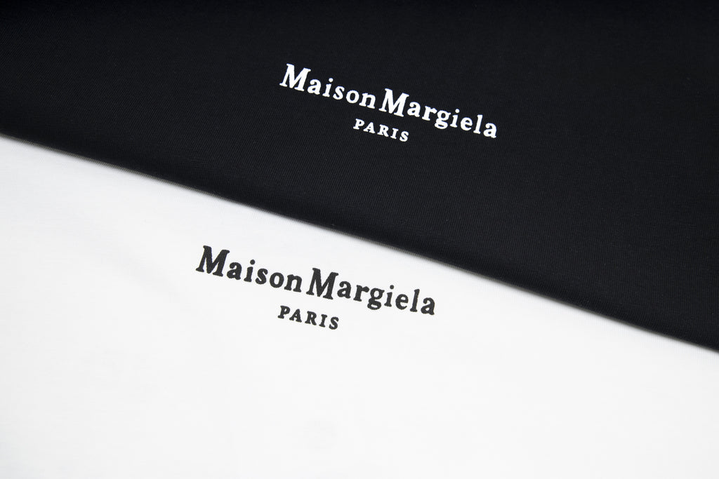 Black T-shirt fabric with Maison Margiela PARIS logo print