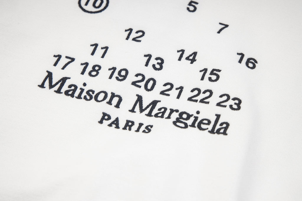 Maison Margiela chest graphic with number set and logo, close-up