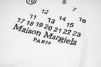 Maison Margiela chest graphic with number set and logo, close-up